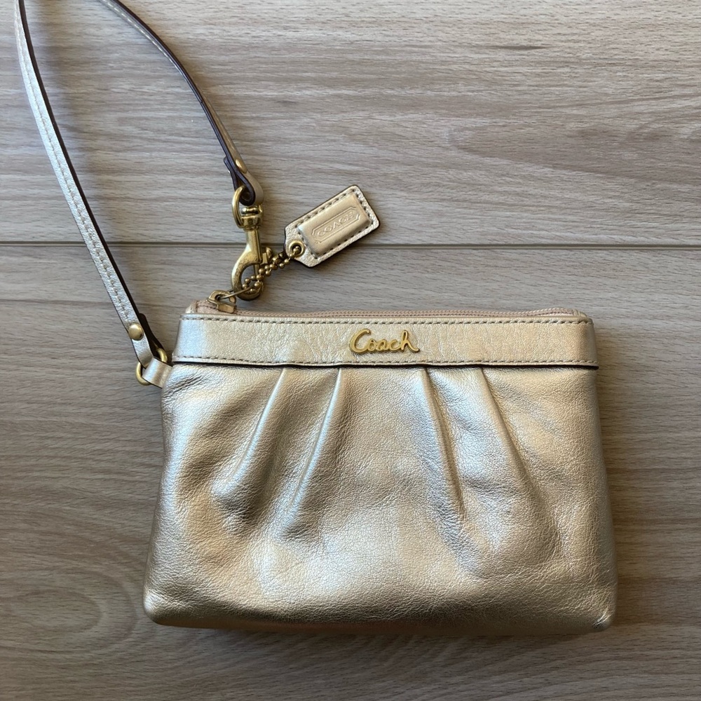 COACH | gold leather wristlet